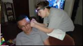 Nicole  operating on Rey's ears