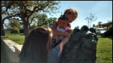 Natalie and Nora sitting on the lion