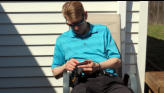 Eric checking golf scores.