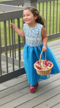Arlene made Nora's dress using lace from the wedding dress.