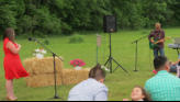 Eric playing and singing closing song.