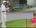 Eric helping Nora learn the game.