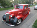 Former neighbor stops by in his restored car.