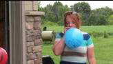 Kris helps with the baloon project.