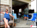 Bob gets the grill ready.