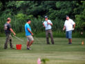 Larry, Rey, Eric and Tim playing bucket golf.