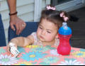 Nora playing with cow