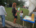 Auntie Kris feeding Nora Cotton Candy.