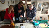 Greta, Eric and Mike looking over Grandma's picture albums.