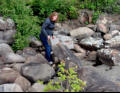 Sue searching for pebbles.