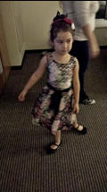 Nora swirling in her new wedding outfit.