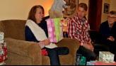 Sue receives her gift from Nora.
