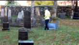 Arlene walking the cemetary.