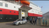 Passenger departing in automobile