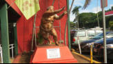 Mother's Statue Of Son By Her Restaurant.